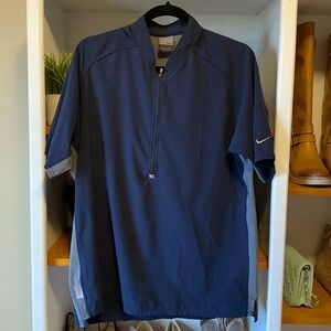 Nike Dri Fit Golf Shirt. Size Medium. Zippered front. Logo on sleeve. 21” PTP.